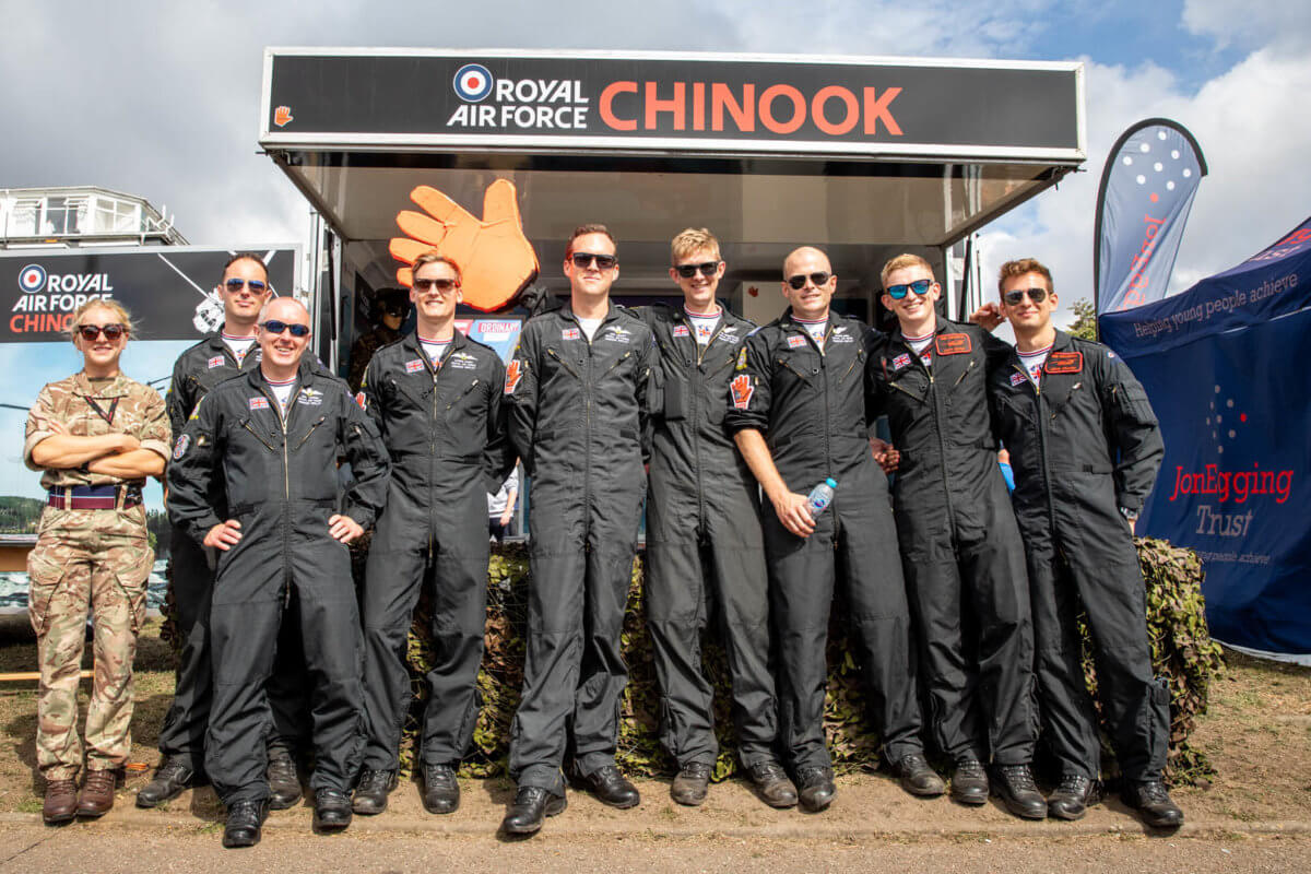 The RAF chinook team posing in front of their stand at the air show