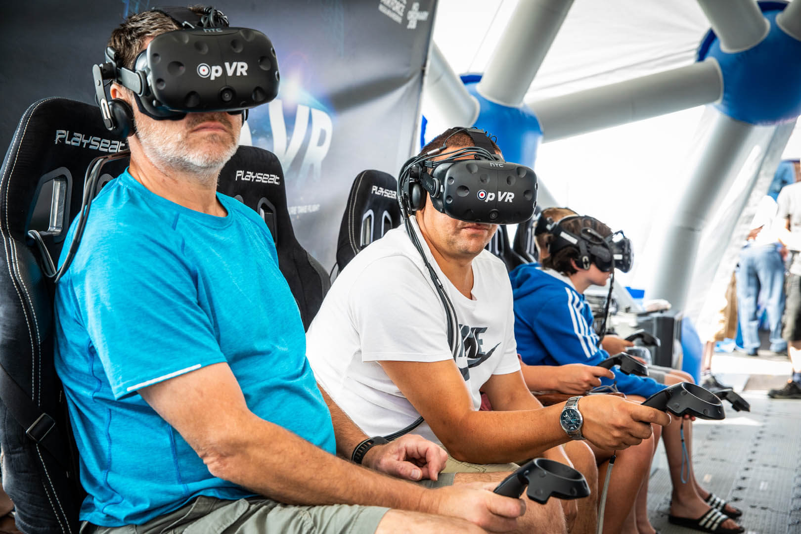Visitors enjoy a go on the VR headsets at the RAF village