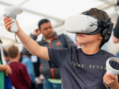 kid playing with a VR headset at the Air Show