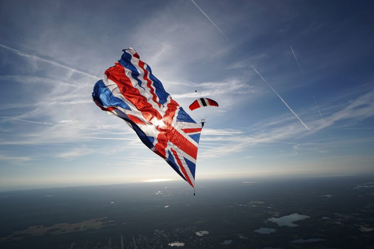 The Red Devils Army Parachute Display Team with a huge Union Flag.